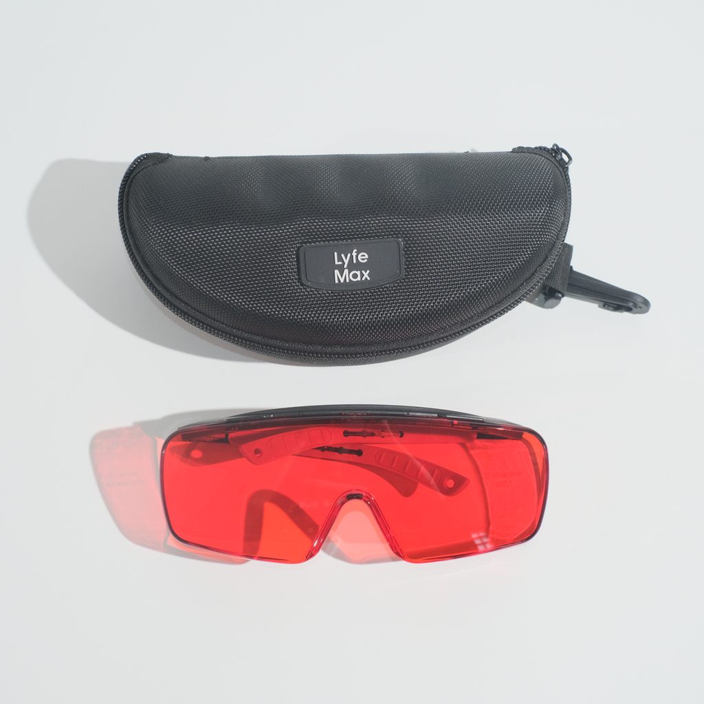 The Deep Red fit-over glasses below a black zip-around hard case with a Lyfe Max badge and a clip.